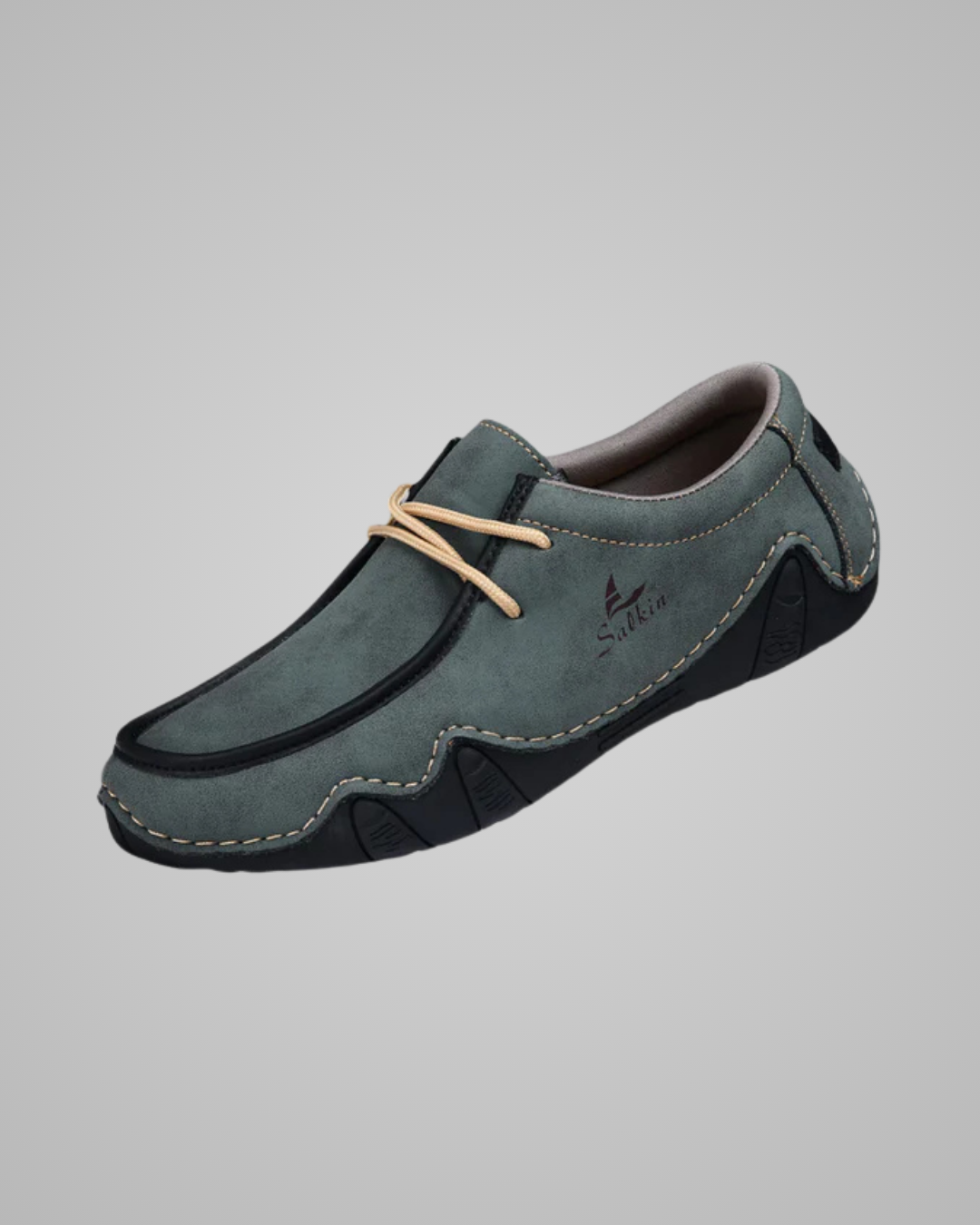 Gray loafer shoe on a gray background
