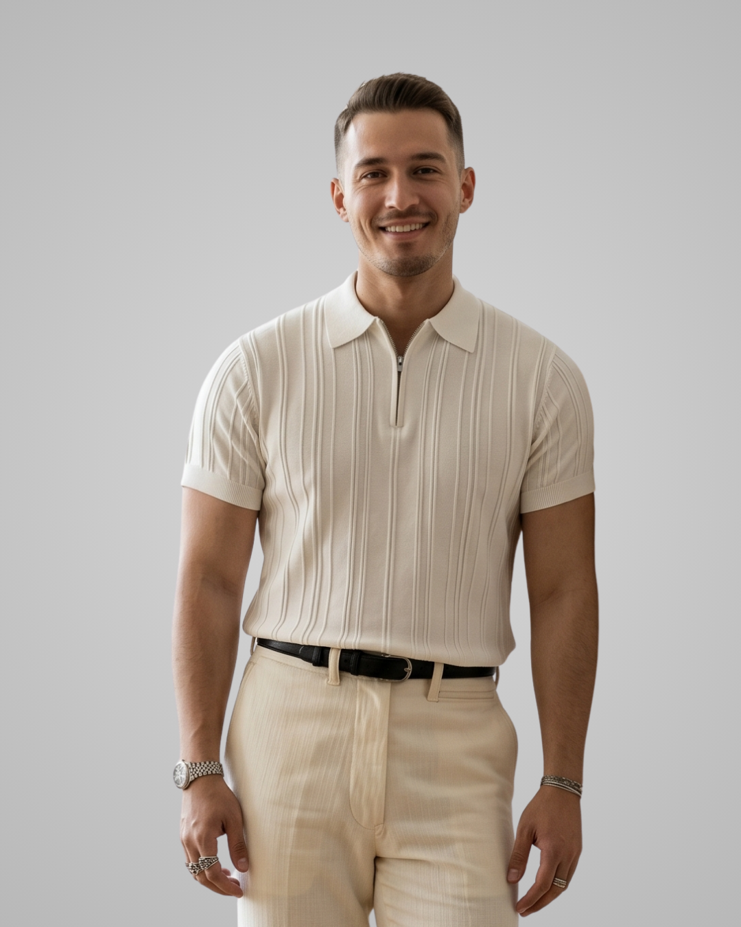 Man wearing a beige striped shirt and pants against a gray background