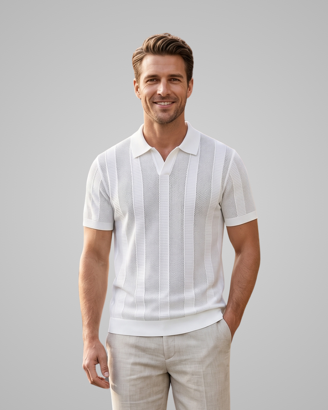 Man wearing a white striped polo shirt and beige pants against a gray background