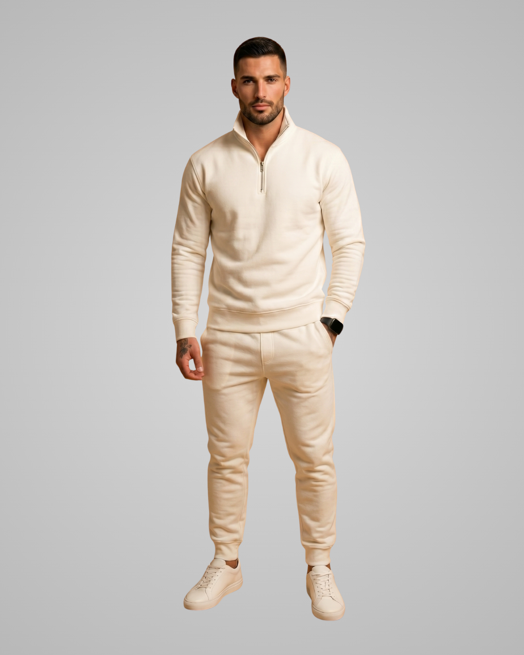 Man wearing a beige outfit on a gray background