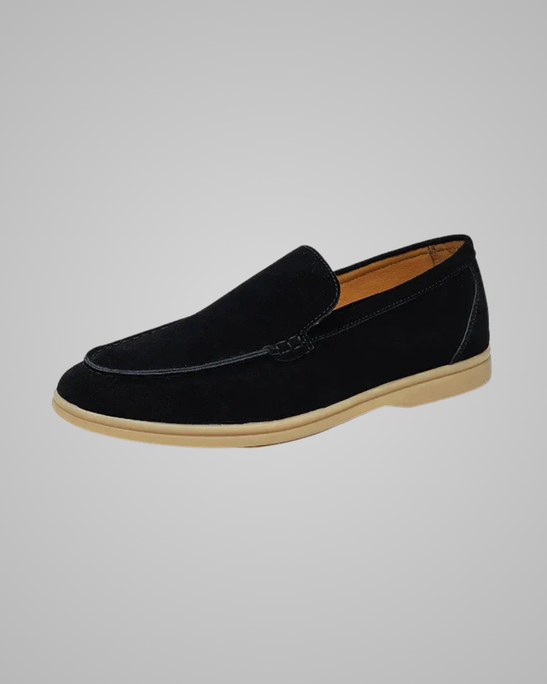Black leather dress shoe on a light gray background