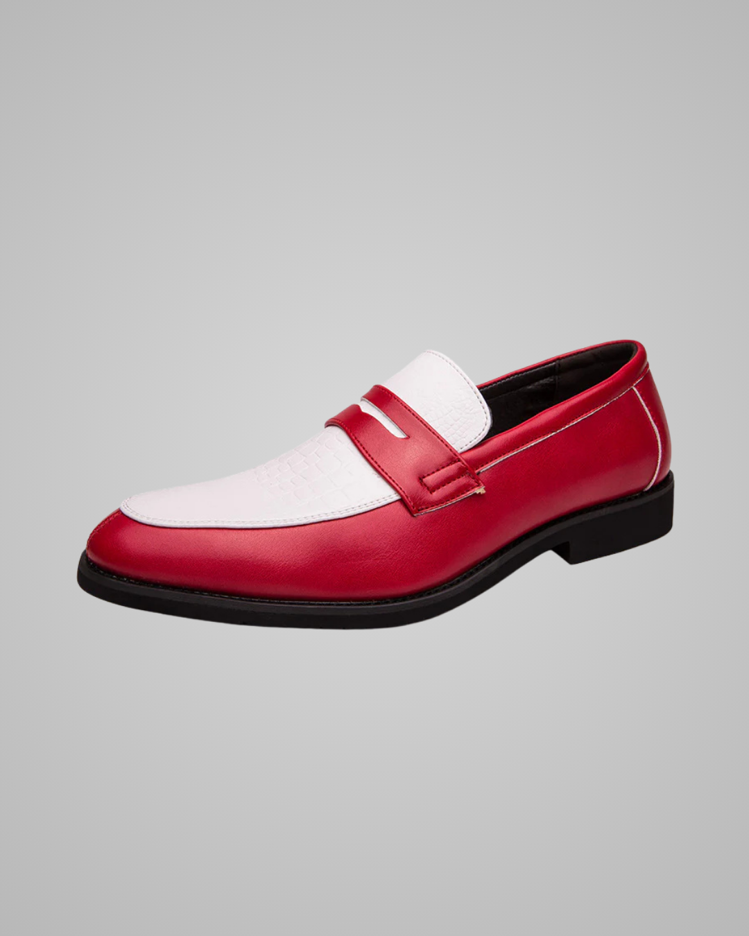Red and white loafer shoe on a gray background