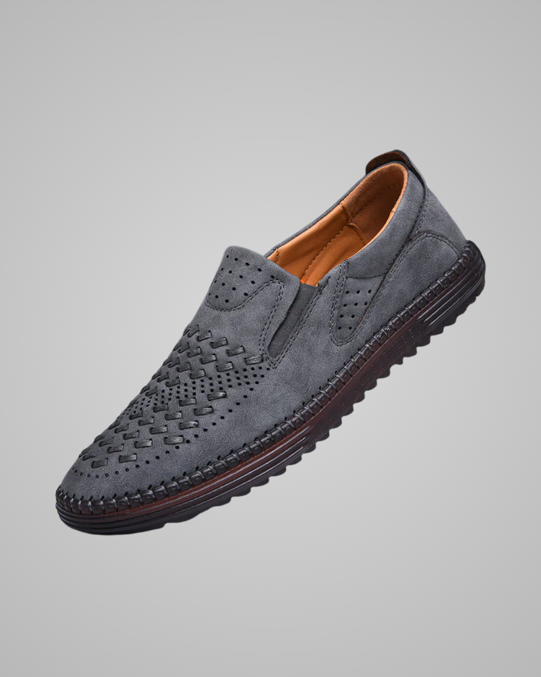 Gray suede loafer shoe on a light gray background