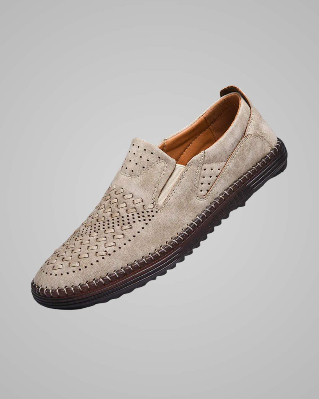 Beige loafer shoe on a gray background