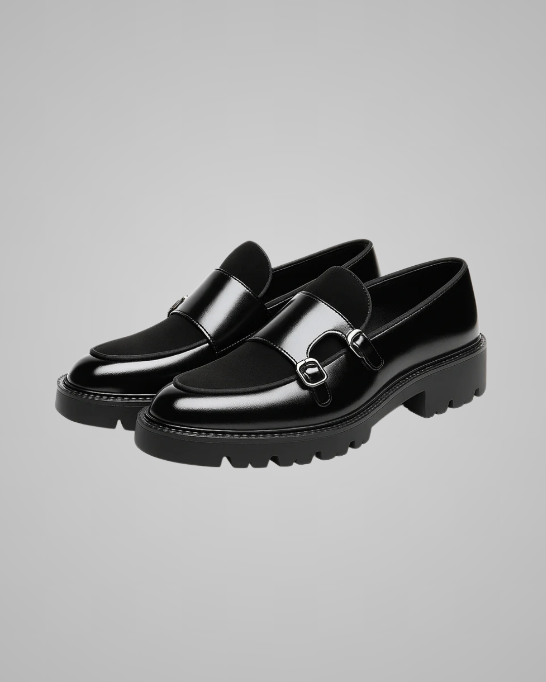 Pair of black leather shoes on a white background