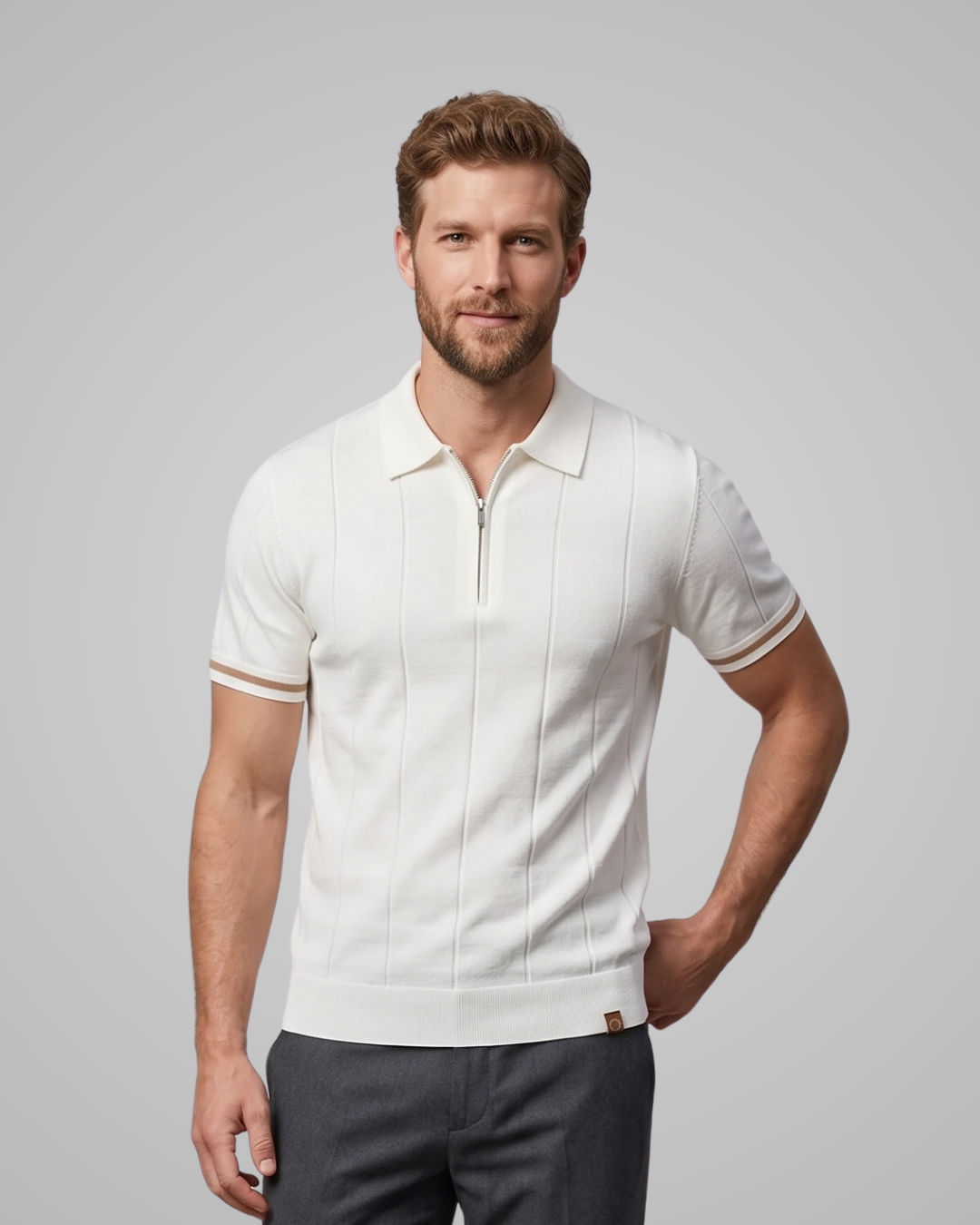 Man wearing a white polo shirt with a gray background