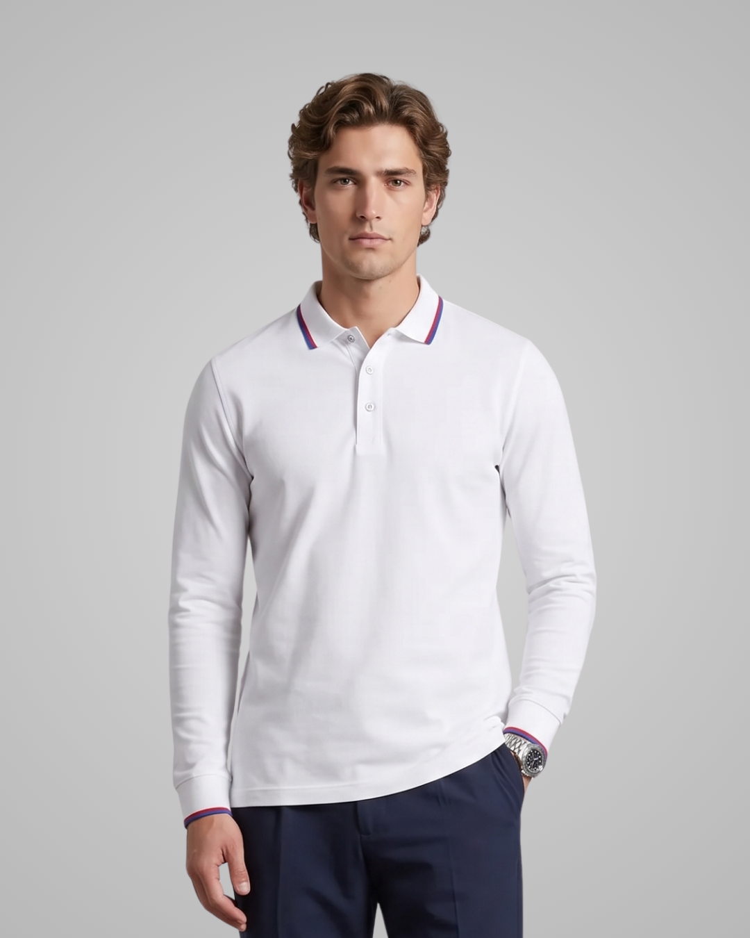 Man wearing a white long-sleeve polo shirt with purple accents on a gray background