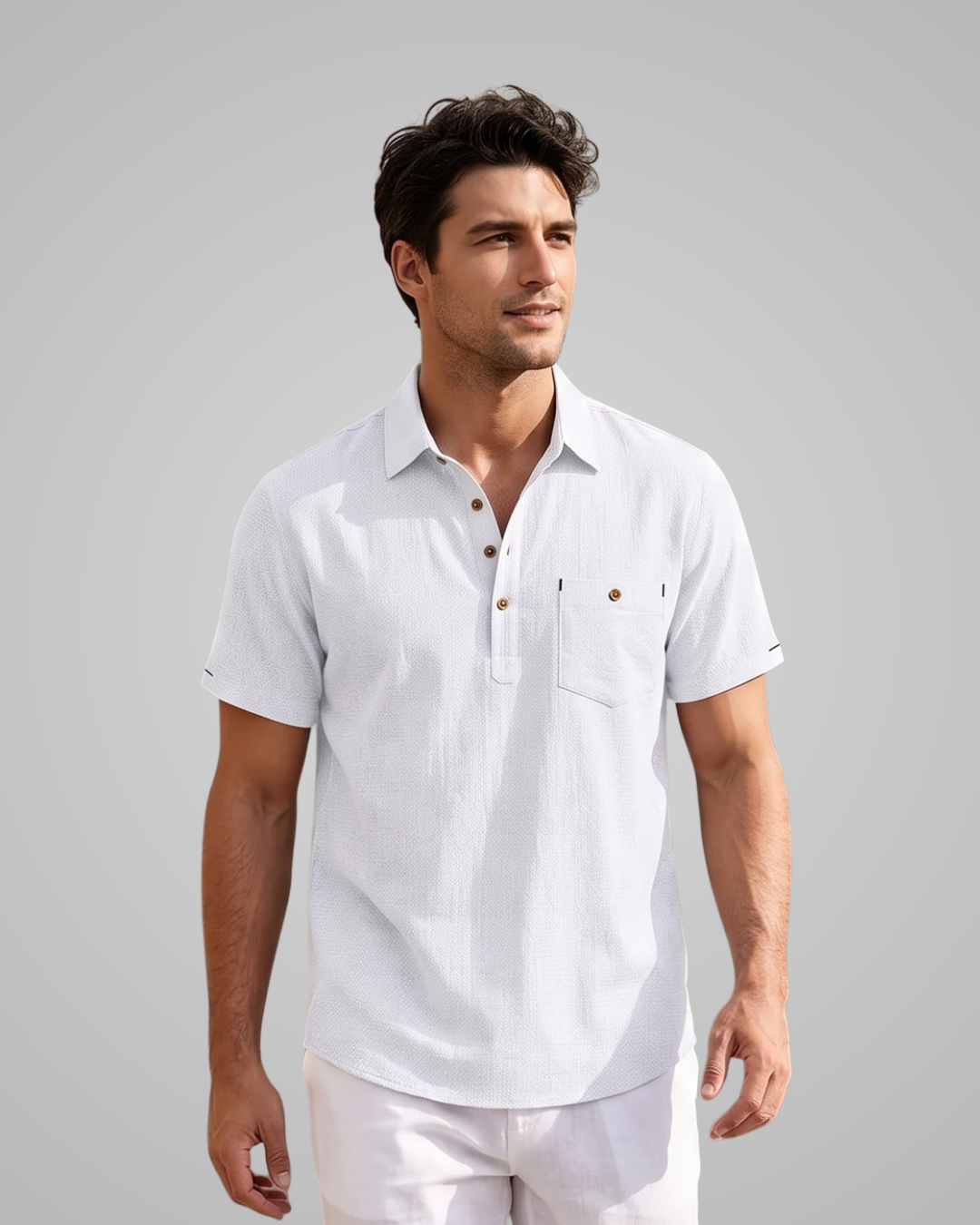 Man wearing a white short-sleeve shirt with button details on a gray background