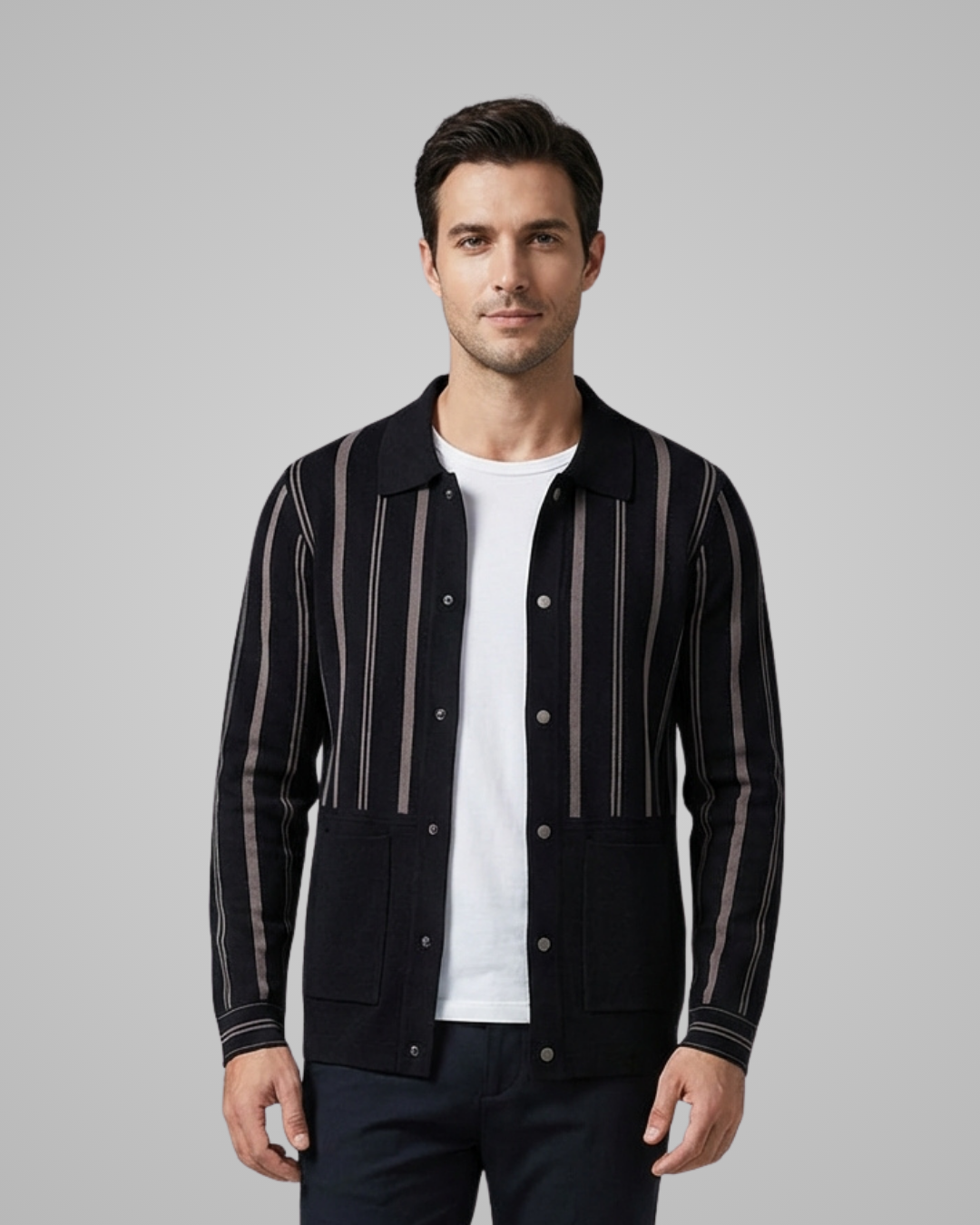 Man wearing a black jacket with white stripes on a gray background