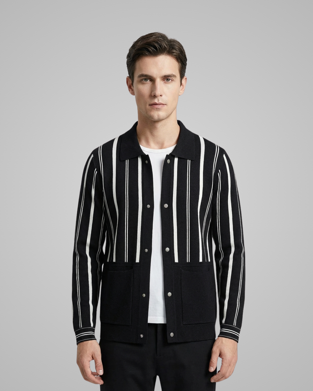Man wearing a black and white striped jacket on a gray background