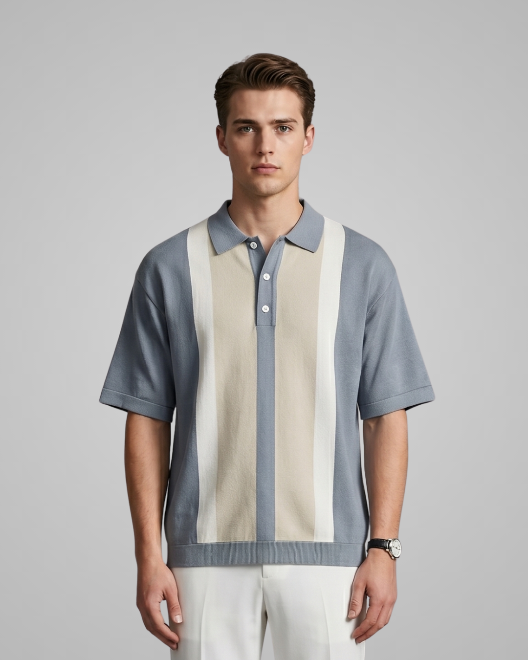 Man wearing a patterned shirt with a gray and beige design on a plain background