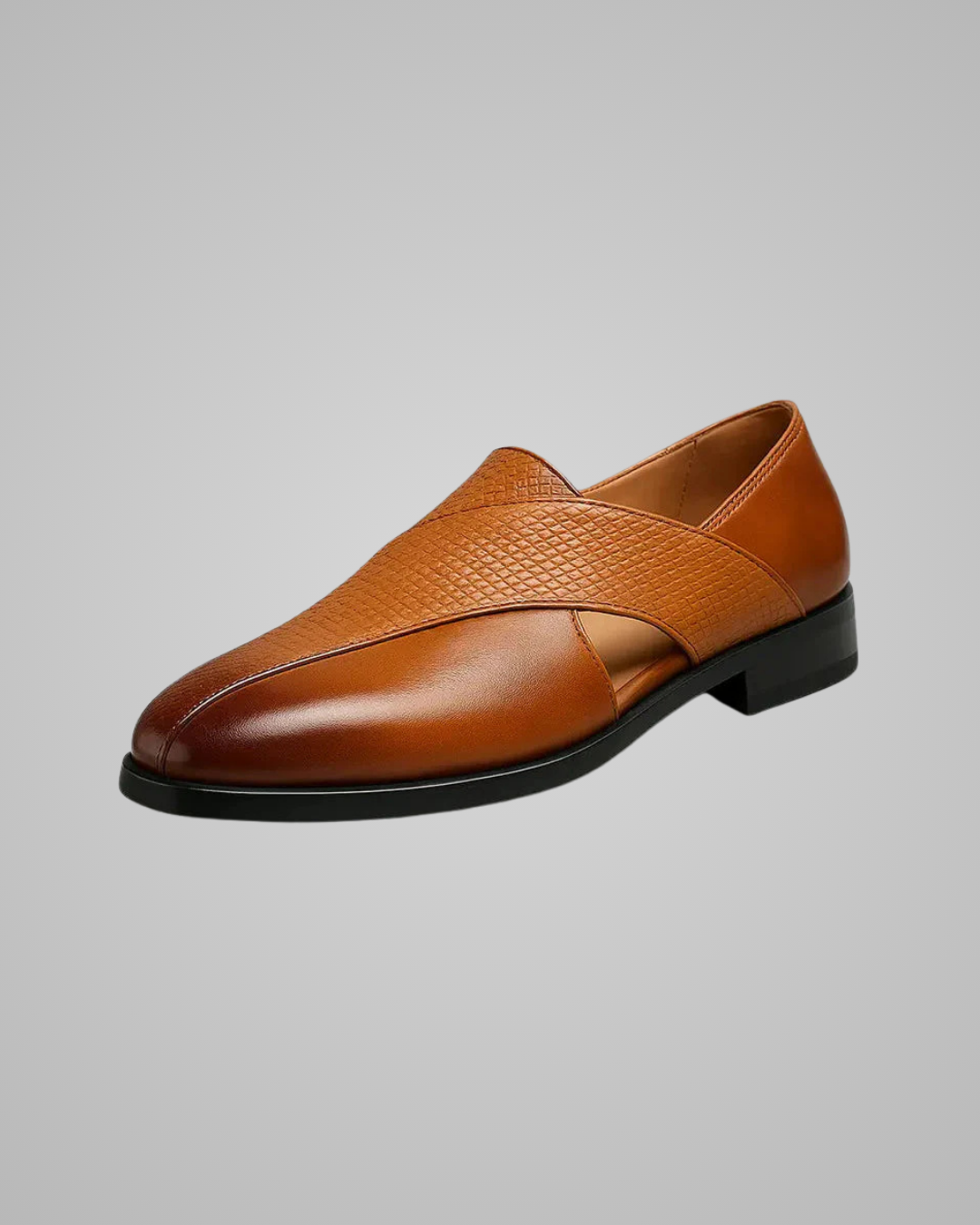 Brown leather loafer shoe on a gray background