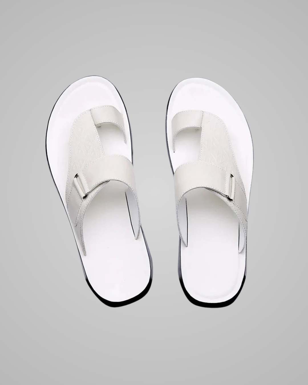 Pair of white sandals on a gray background