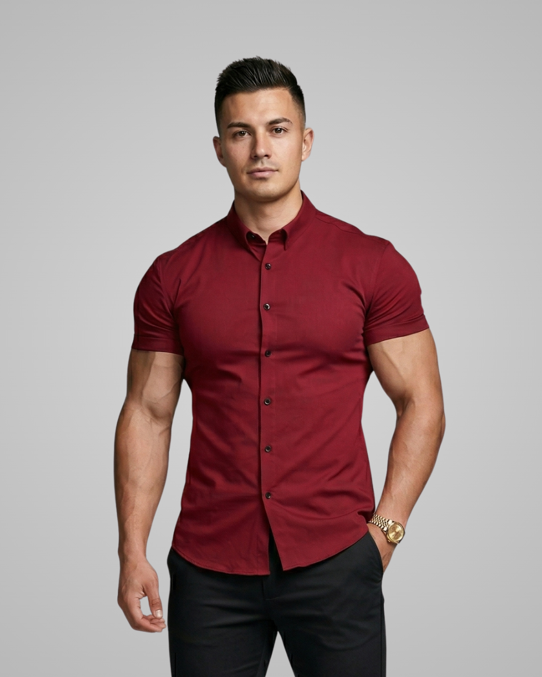 Man wearing a red button-up shirt against a gray background