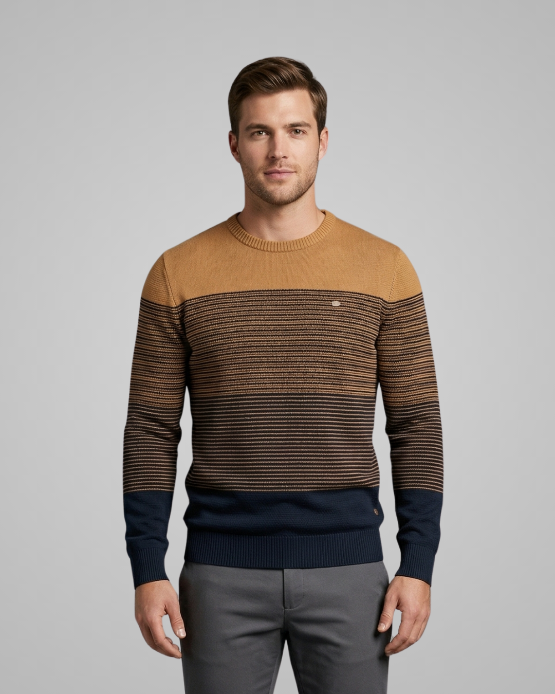Man wearing a striped sweater with a neutral background