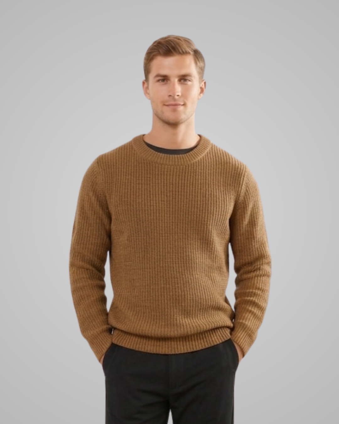 Man wearing a brown sweater against a gray background