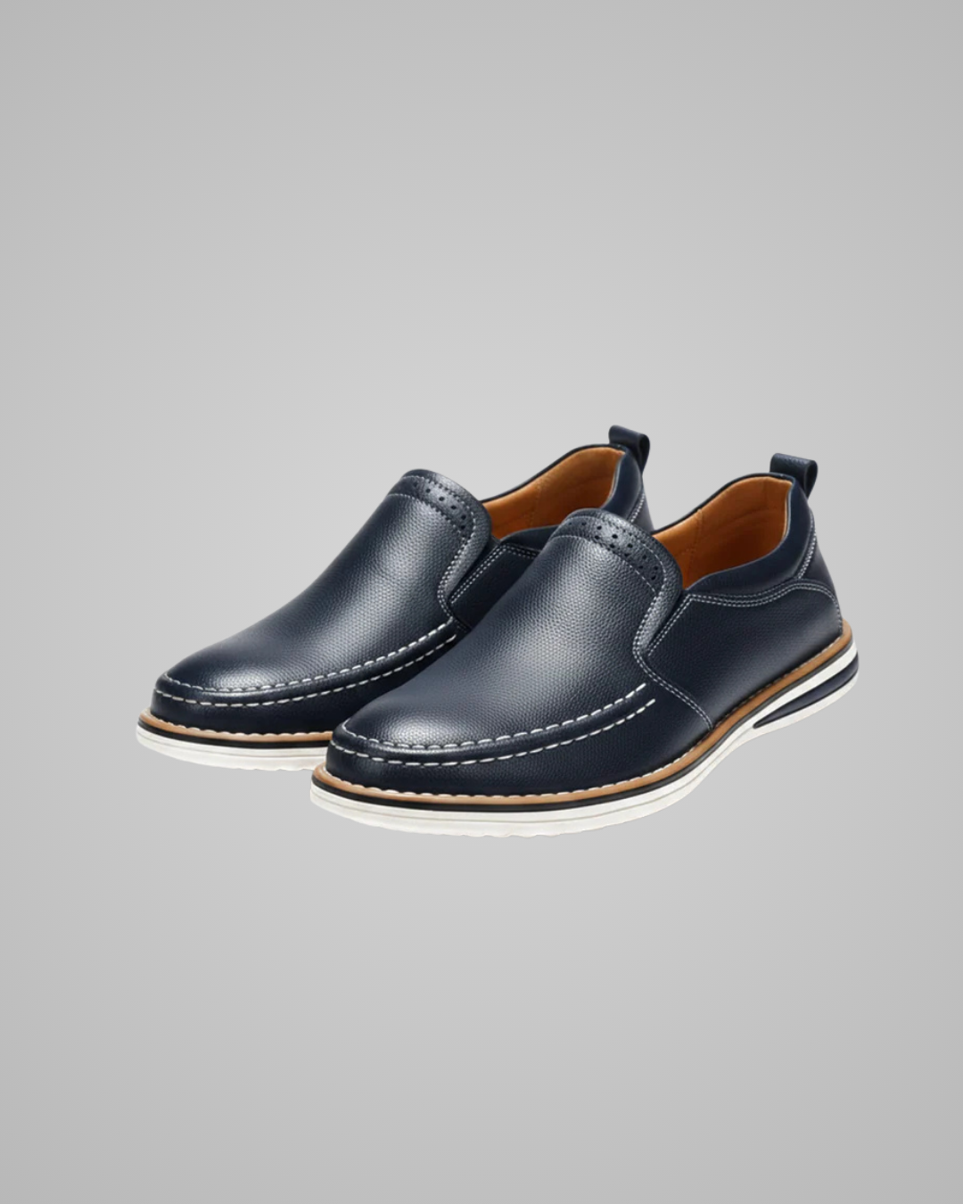 Pair of navy blue leather shoes on a gray background