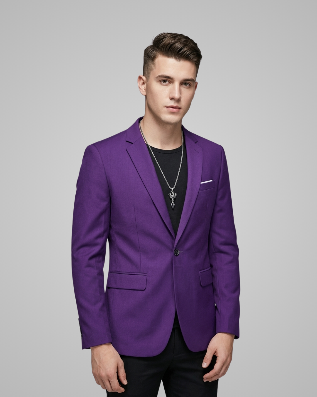 Man wearing a purple blazer against a gray background