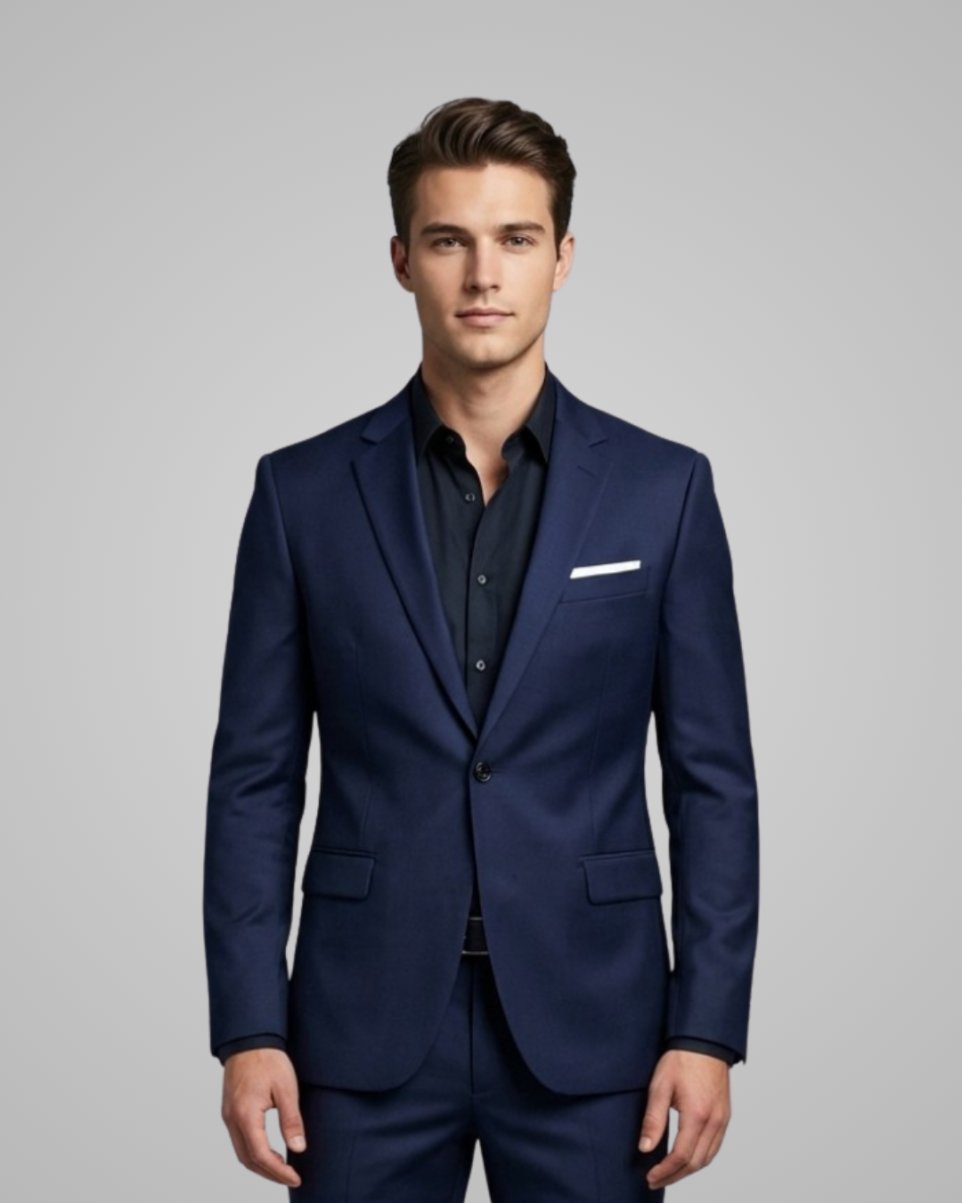 Man wearing a navy blue suit with a gray background
