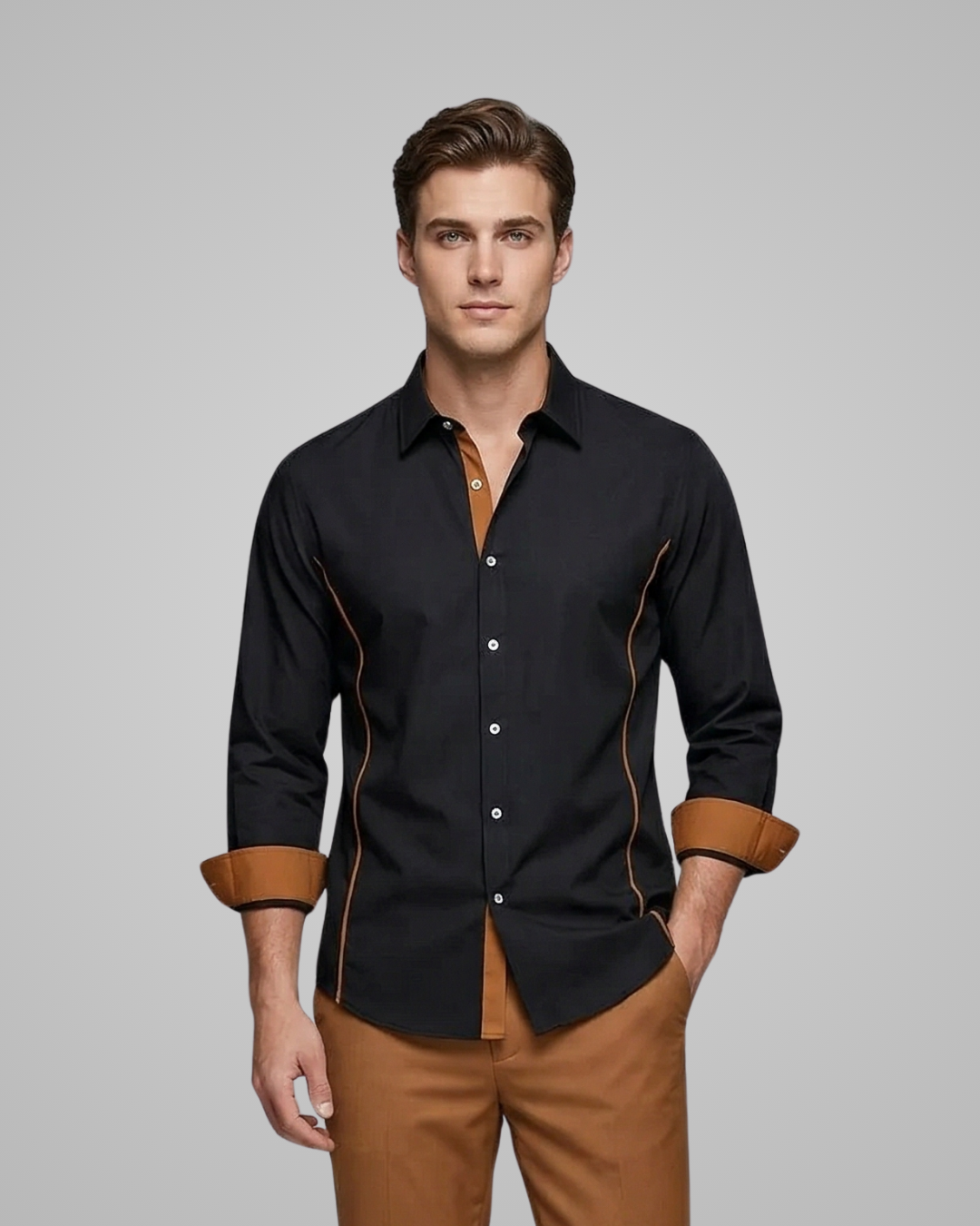 Man wearing a black shirt with brown accents on a gray background