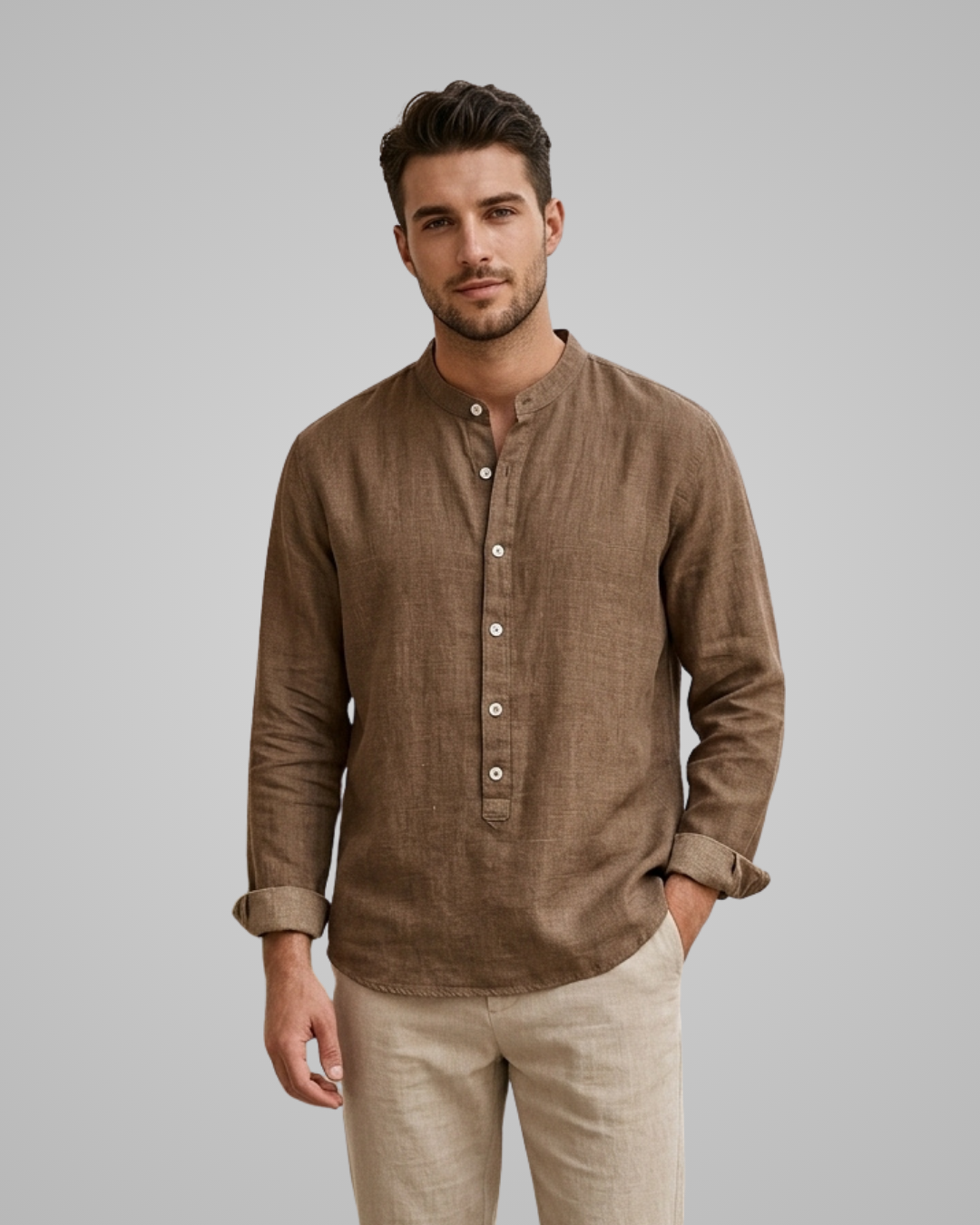 Man wearing a brown long-sleeve shirt with buttons on a gray background