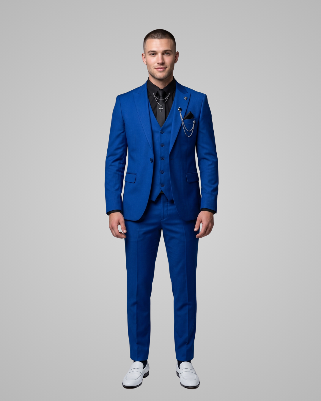 Man wearing a blue suit with white shoes on a gray background