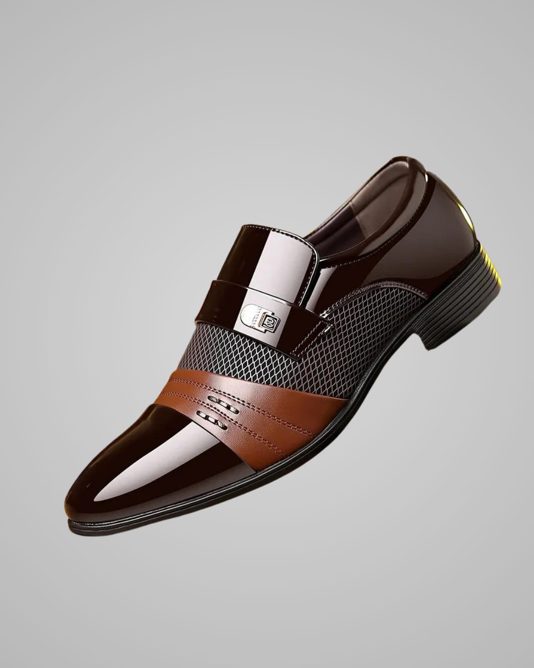 Brown dress shoe with a silver buckle on a gray background