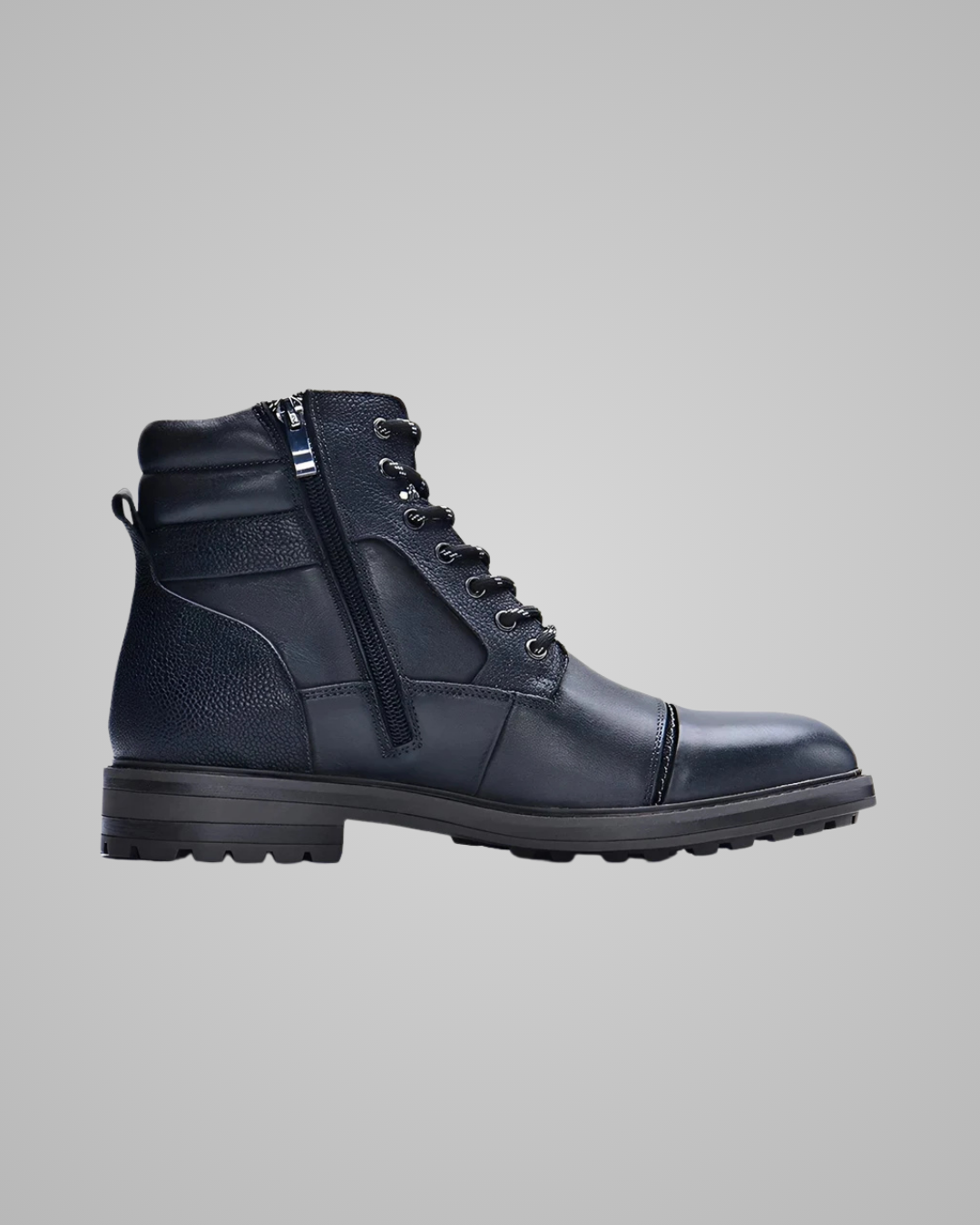 A dark navy blue leather lace-up ankle boot with a side zipper, shown in profile against a solid gray background.