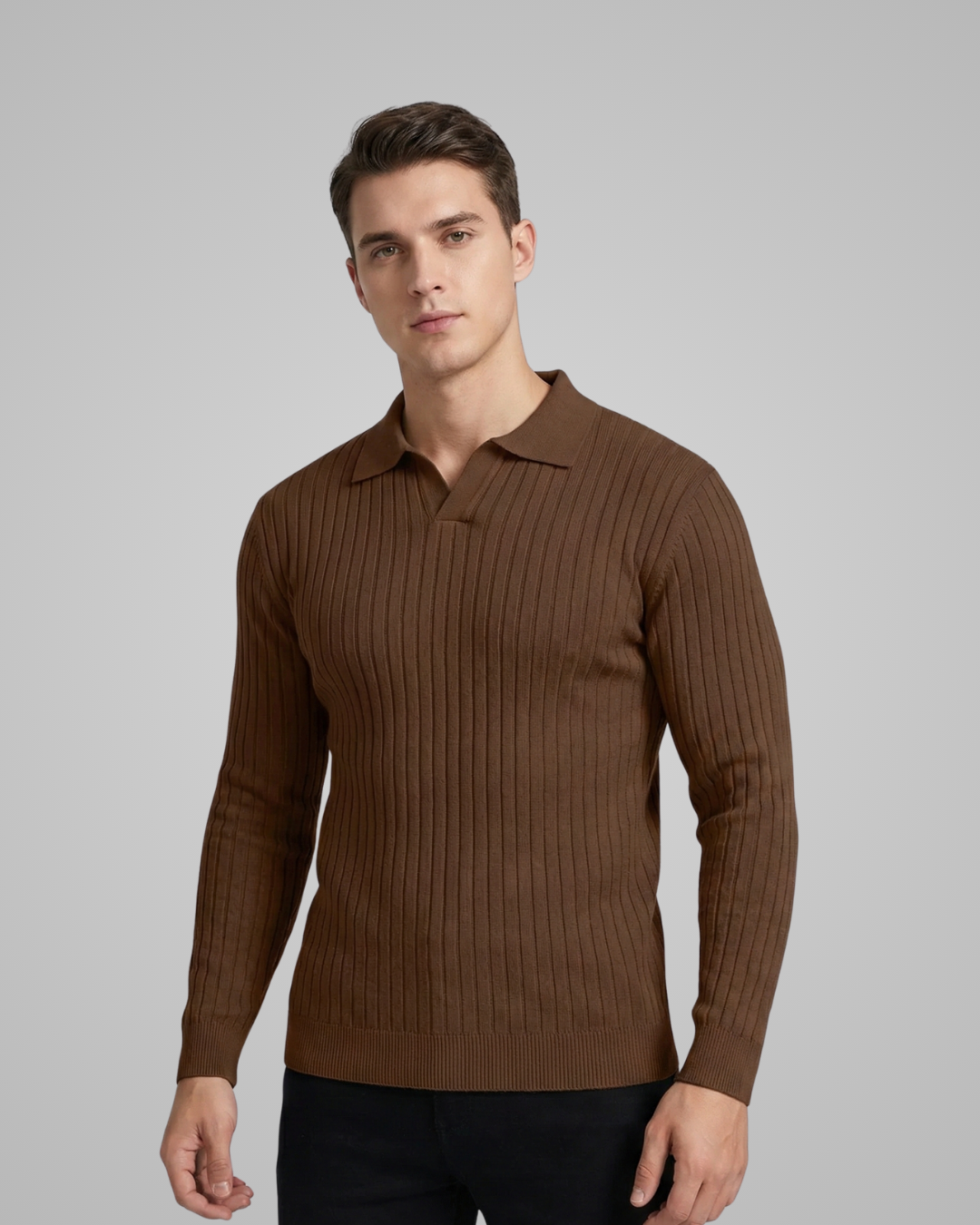 Man wearing a brown ribbed long-sleeve shirt against a gray background