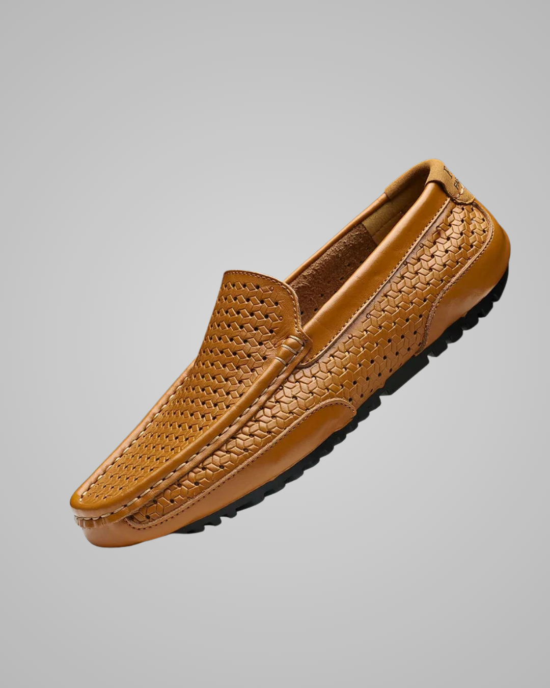 Brown loafer shoe on a gray background