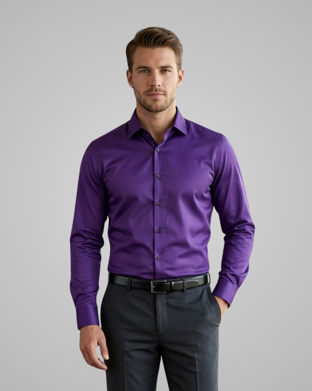 Man wearing a purple dress shirt and black pants on a gray background
