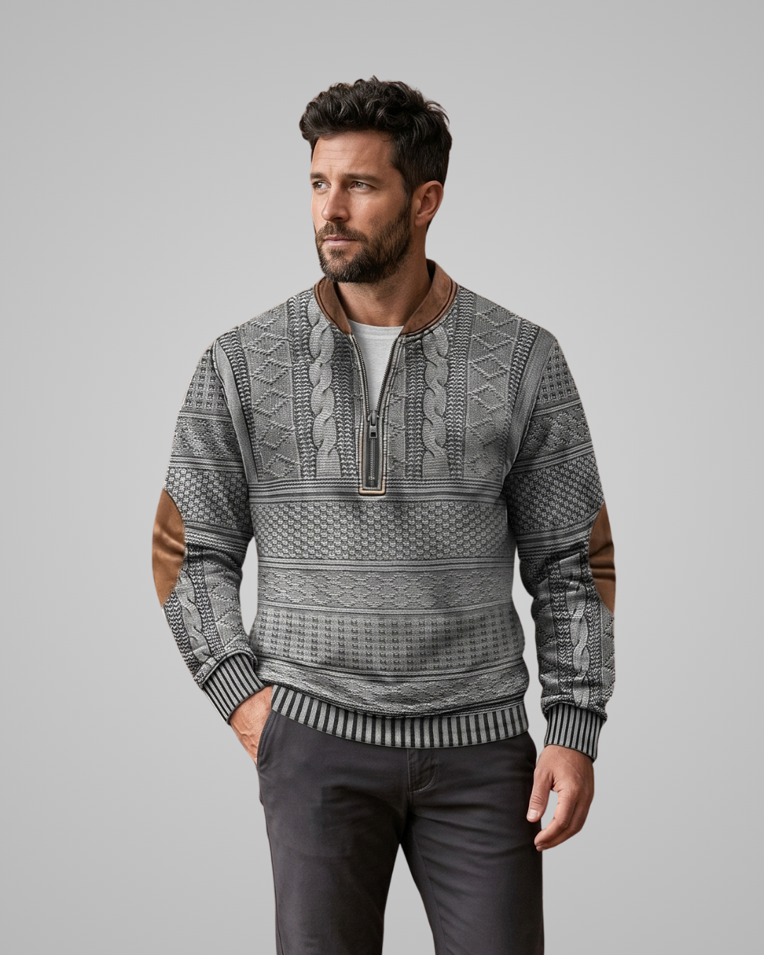 Man wearing a patterned sweater with brown accents on a gray background