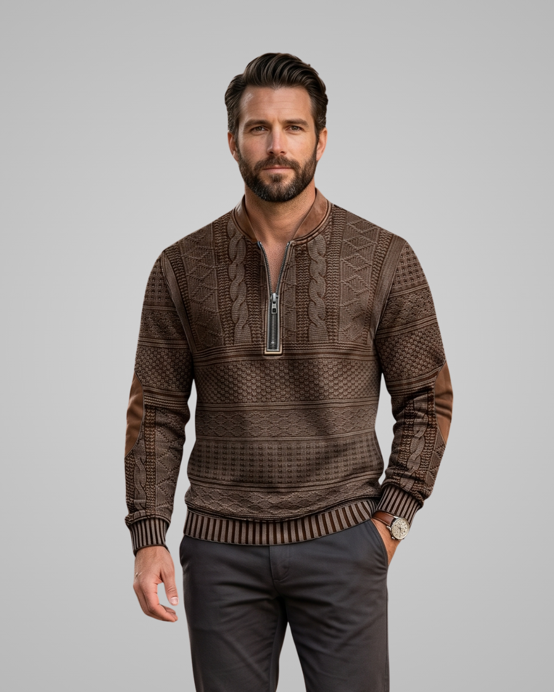 Man wearing a brown patterned sweater on a gray background