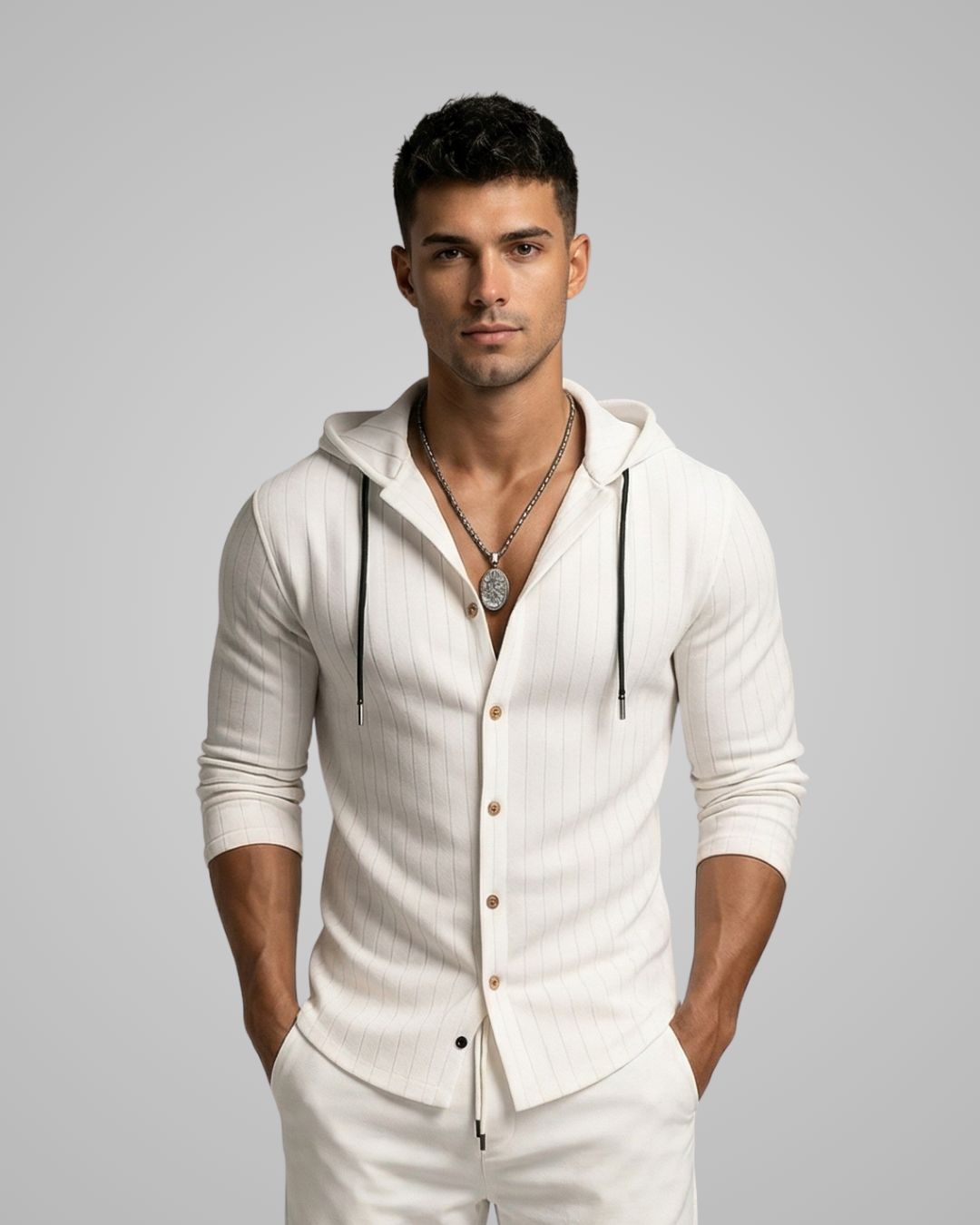 Man wearing a white hoodie with buttons on a gray background