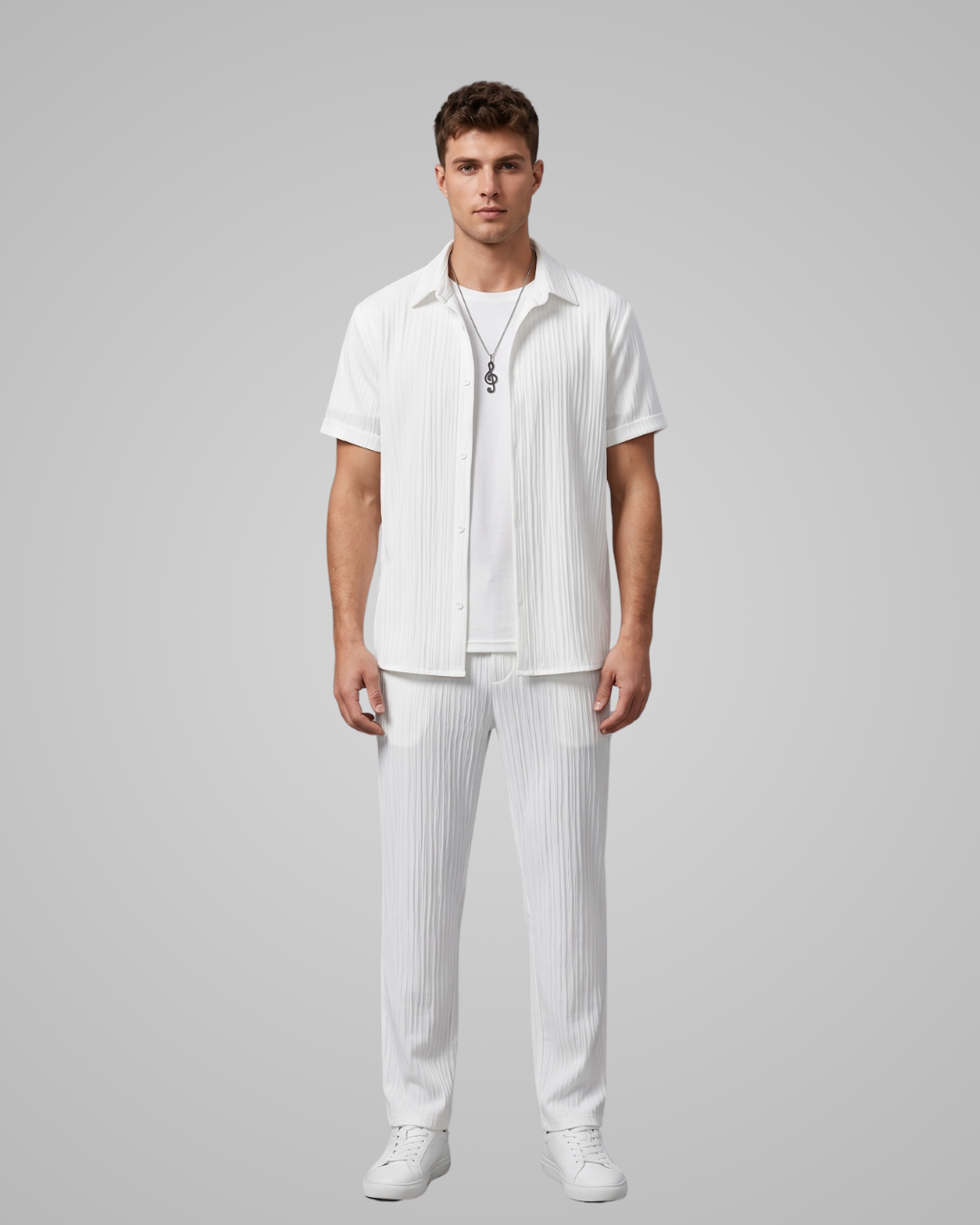 Man wearing a white outfit with a gray background