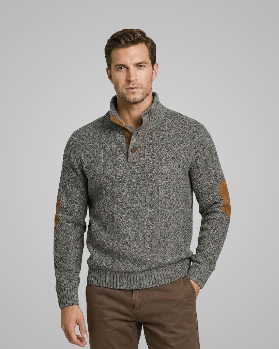 Man wearing a gray sweater with brown elbow patches on a gray background