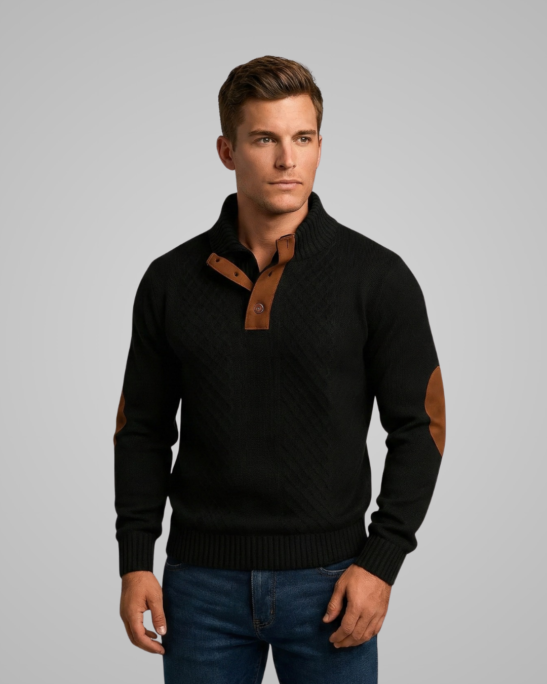 Man wearing a black sweater with brown accents on a gray background
