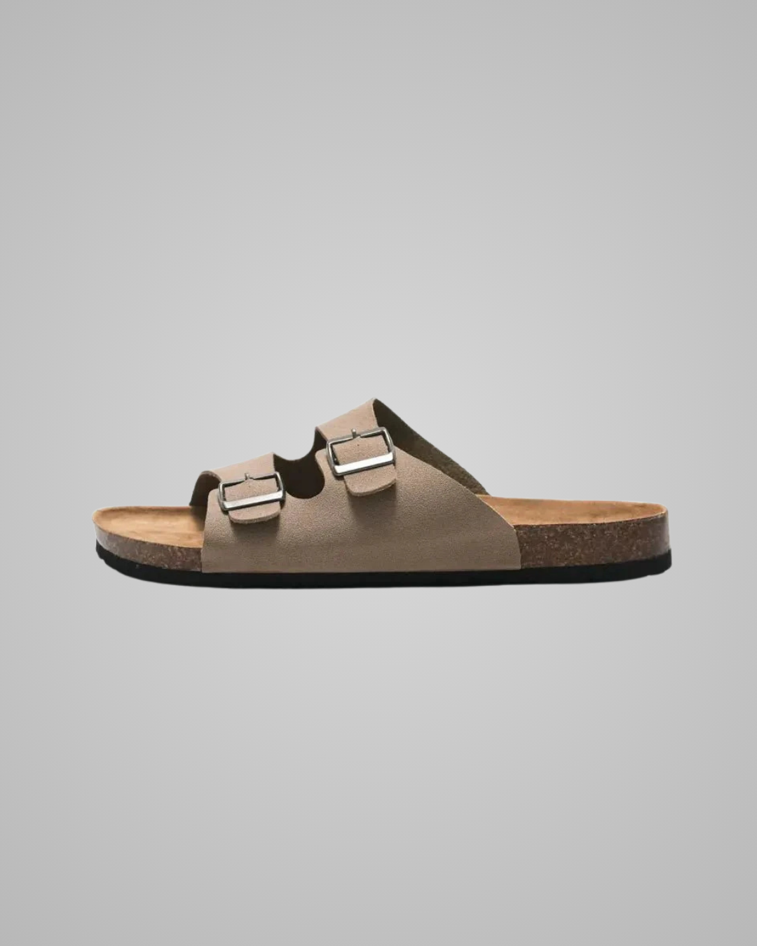 Brown sandal with two buckles on a gray background
