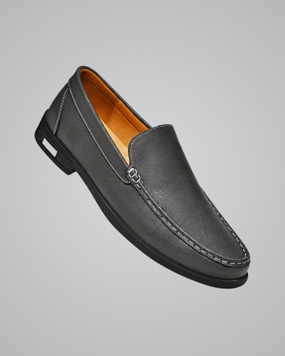 Black loafer shoe on a gray background
