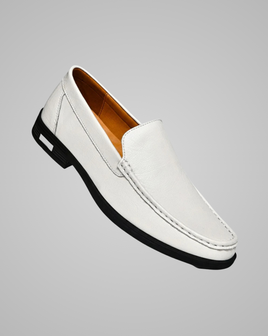White loafer shoe on a gray background