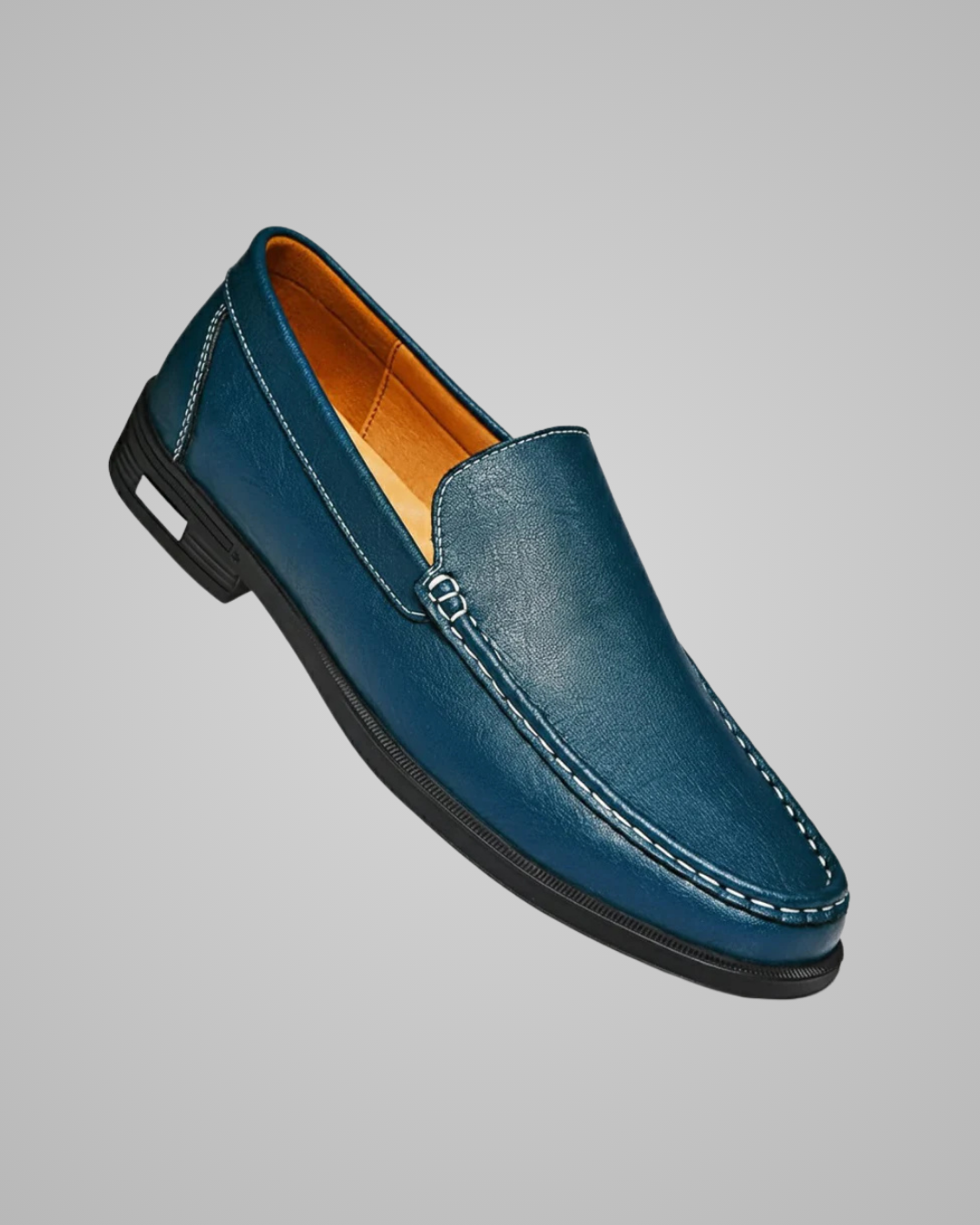 Blue loafer shoe on a gray background