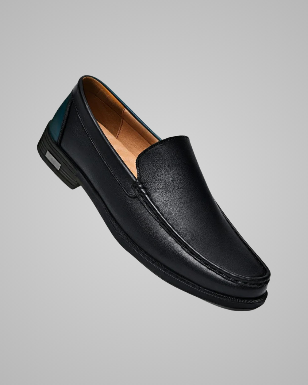 Black loafer shoe on a gray background