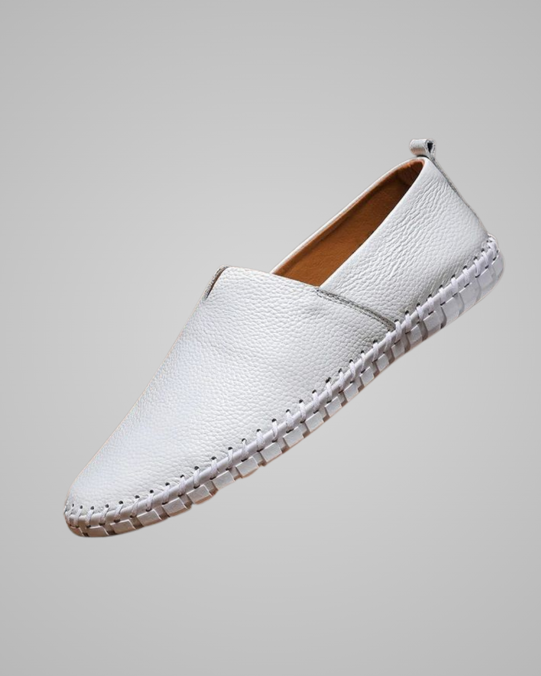 White leather shoe on a gray background