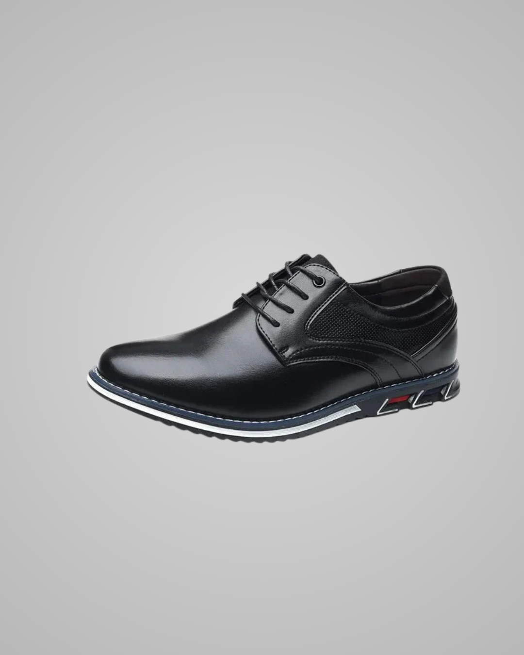 Black leather dress shoe on a gray background