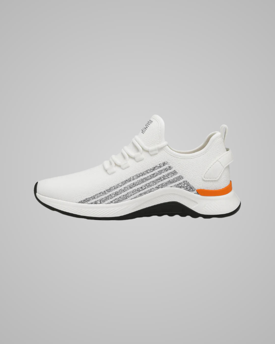 White sneaker with black sole and orange accent on a gray background