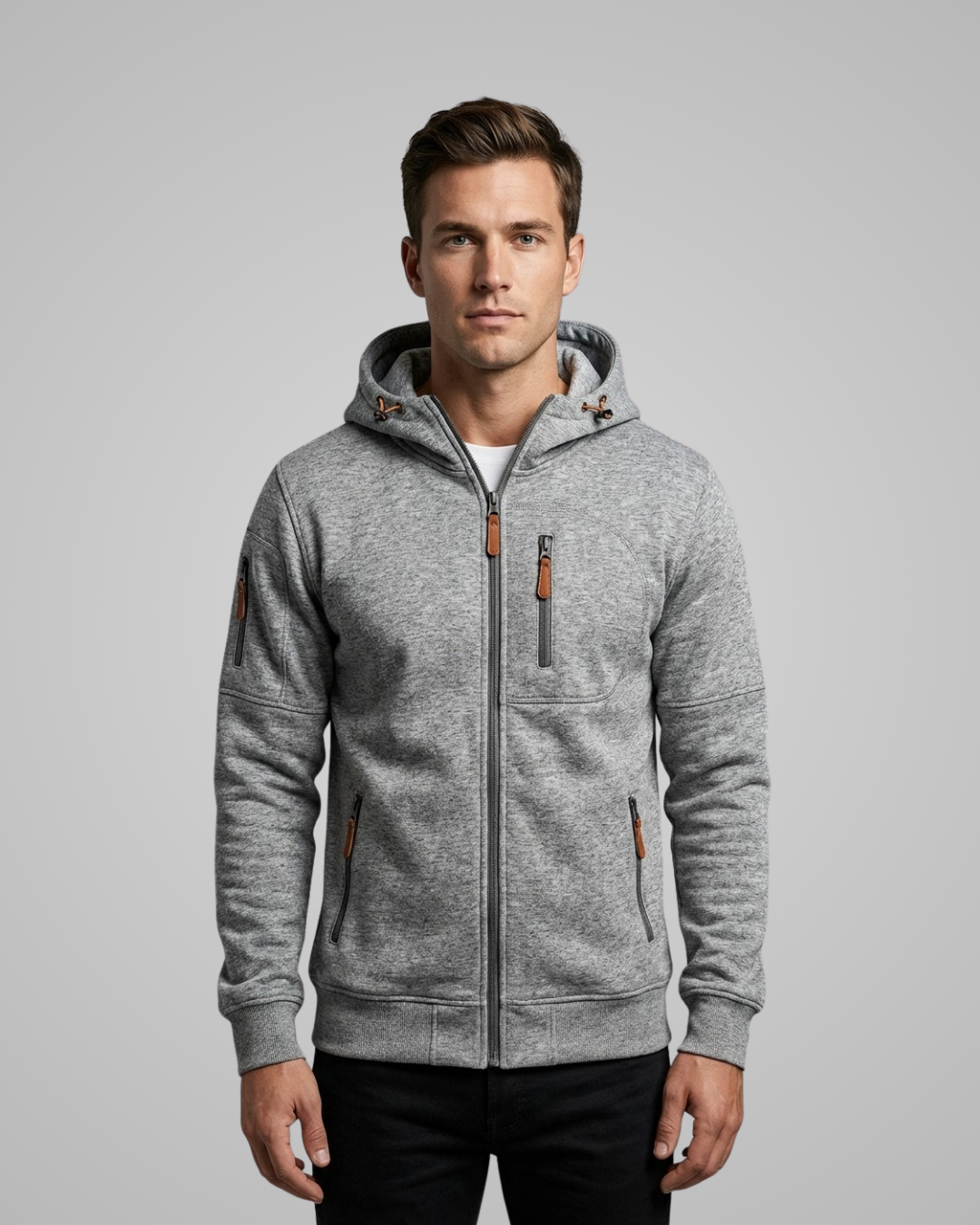 Man wearing a gray hoodie with brown accents on a gray background