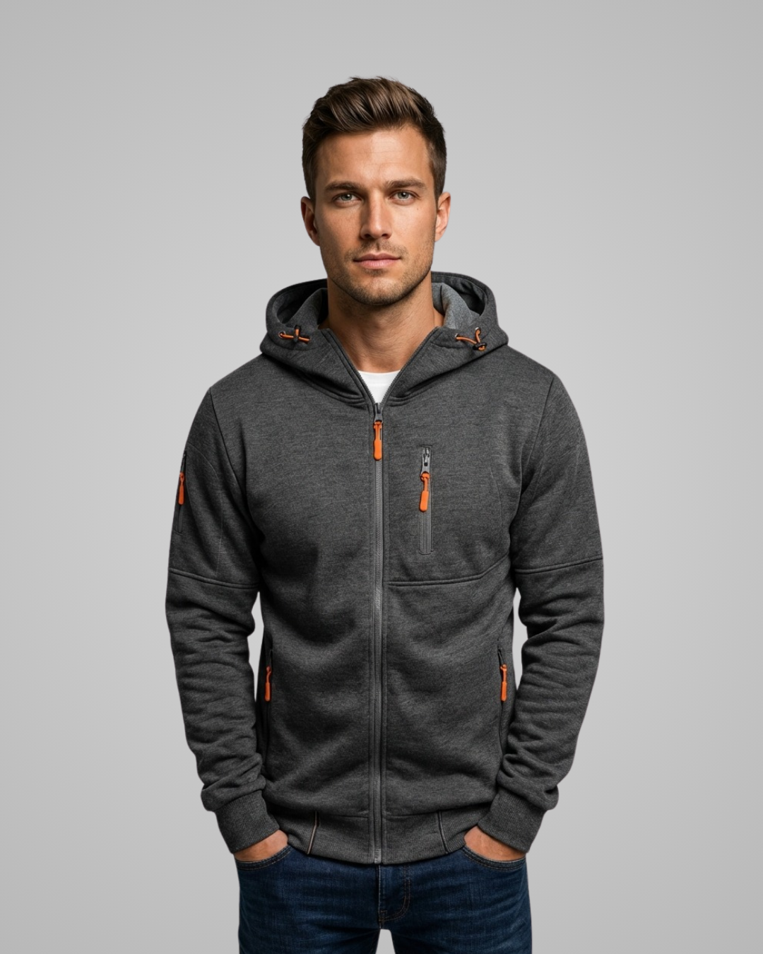 Man wearing a gray hoodie with orange accents on a gray background