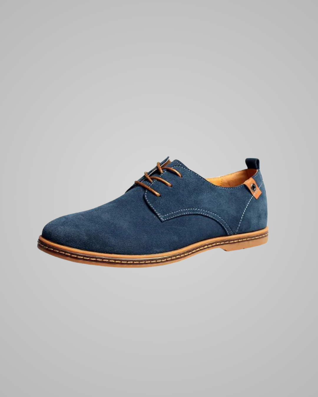 Blue suede shoe with brown accents on a gray background
