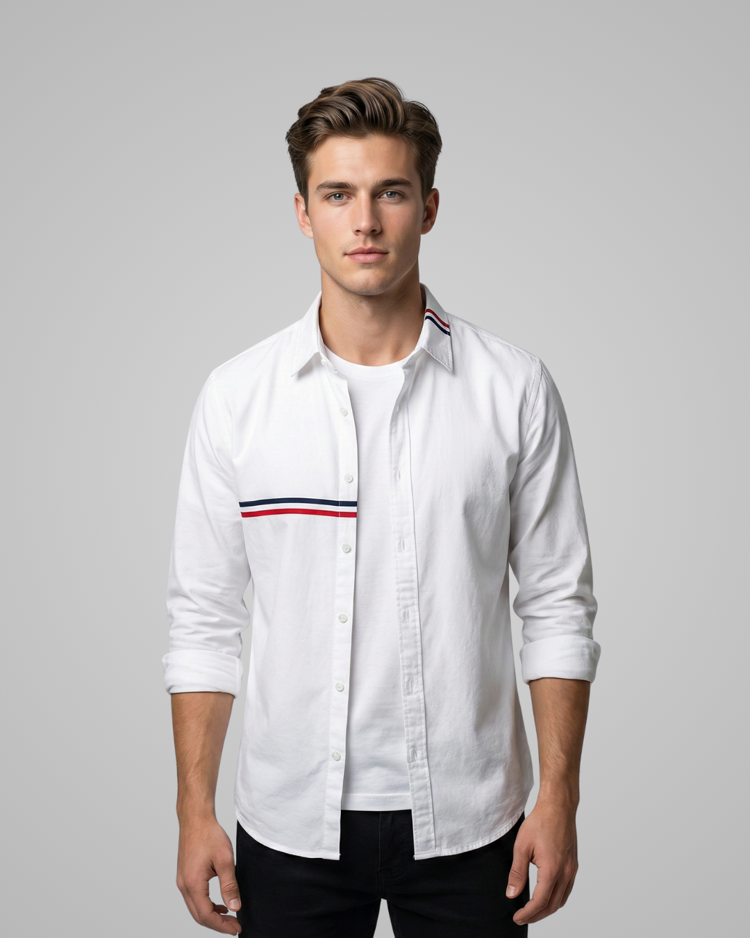 Man wearing a white shirt with a red and blue stripe on a gray background