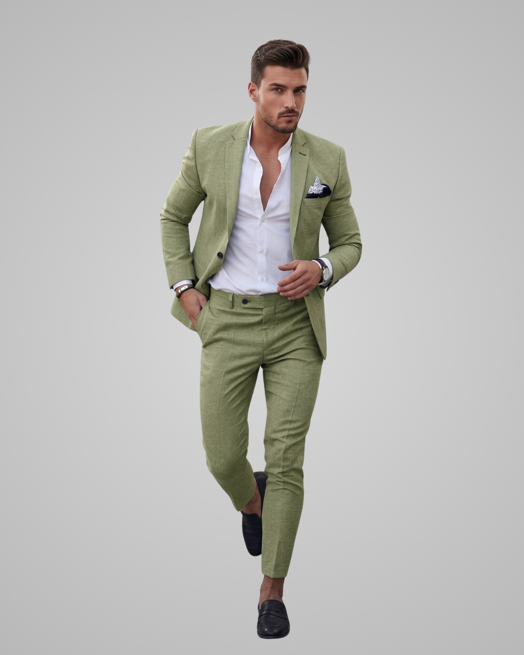 Man wearing a light green suit with a white shirt on a gray background